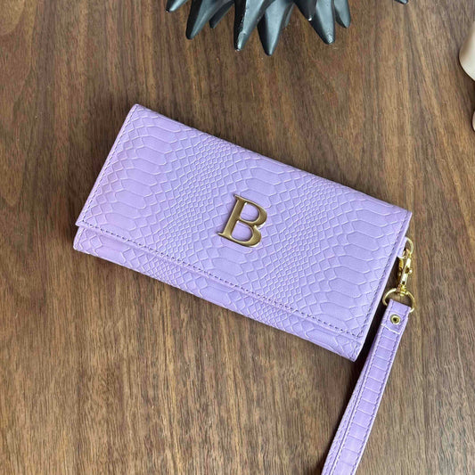 CARTERA MUÑEQUERA LILA