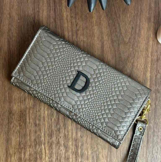 CARTERA MUÑEQUERA METAL ACERO