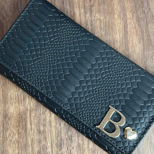 CARTERA MUÑEQUERA NEGRO