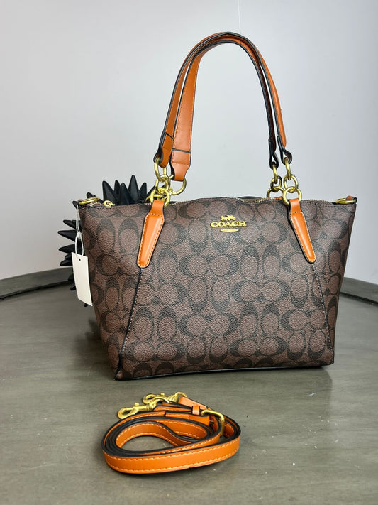 BOLSO COACH AROS CHOCOLATE