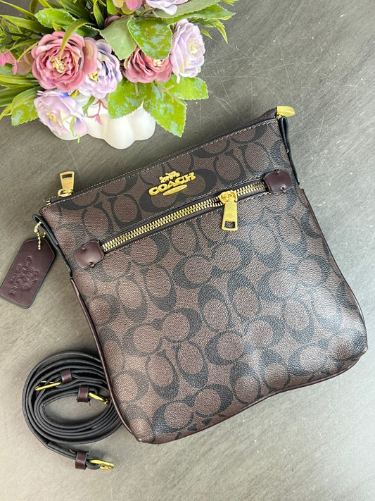 BANDOLERA COACH /CAFE ESTAMPADO