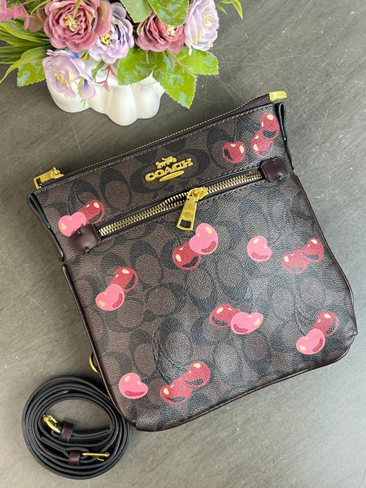 BANDOLERA COACH /NEGRA CON CAFE CEREZAS