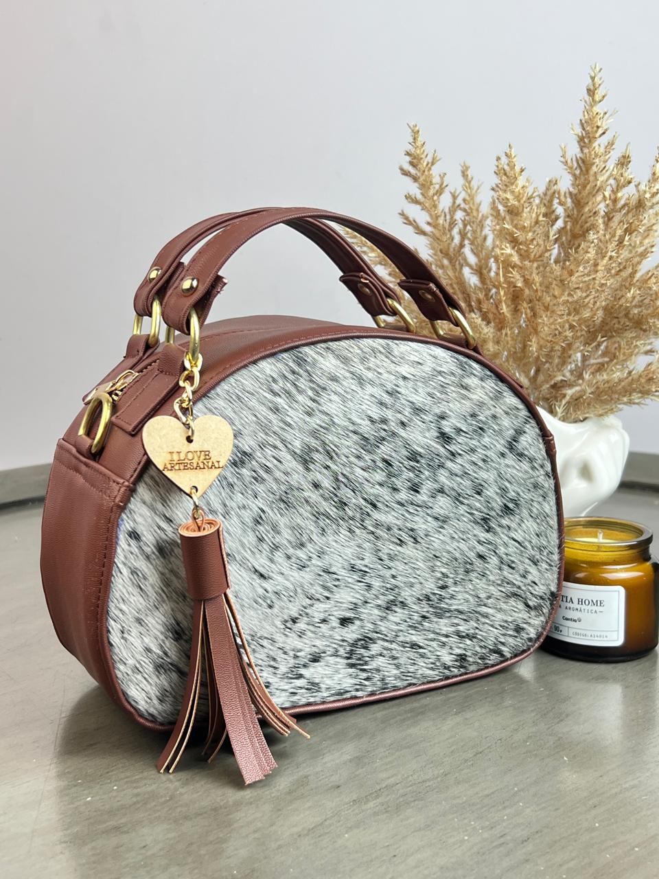 BOLSO MEDIO CIRCULO COMINO PELO VARIABLE