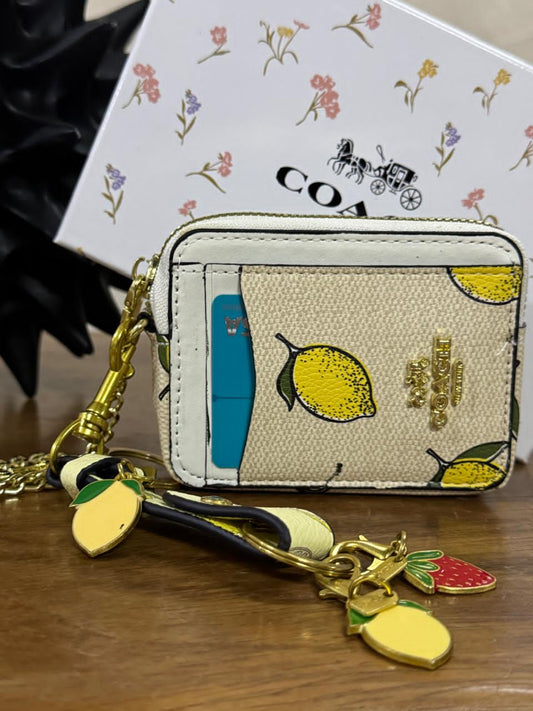 KIT MONEDERO COACH LIMONES BEIGE