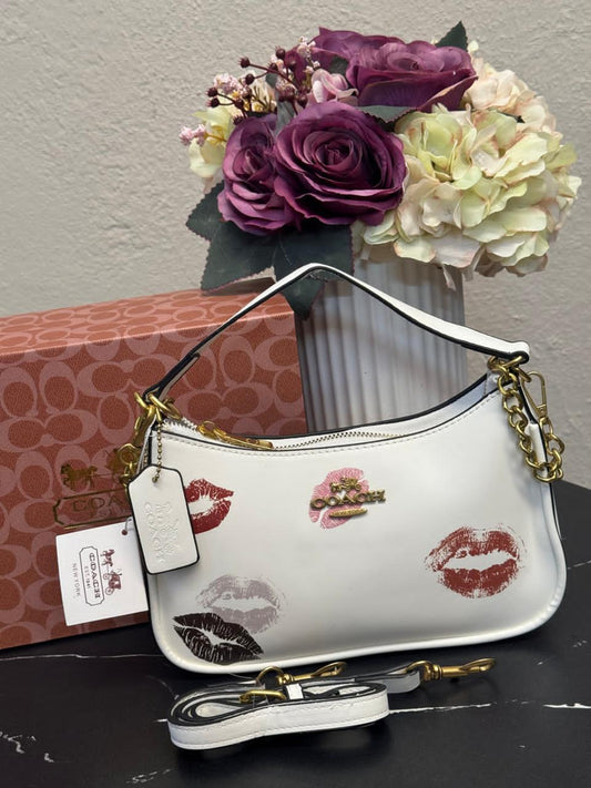 BAGUETTE CADENA COACH BESOS BLANCO
