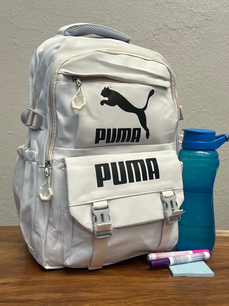 MOCHILA BROCHES PUMA HUESO
