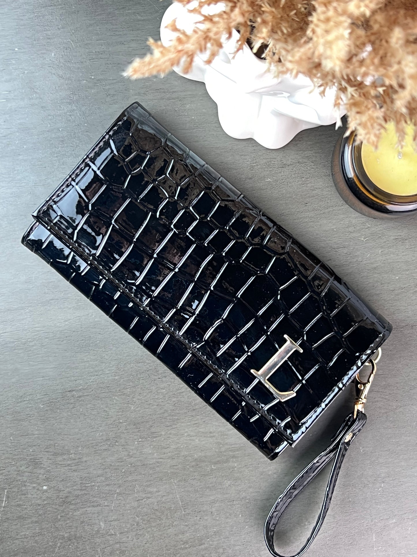 CARTERA MUÑEQUERA NEGRO DRILO CHAROL