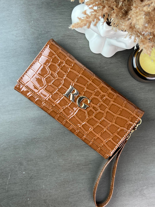CARTERA MUÑEQUERA CAJETA DRILO CHAROL