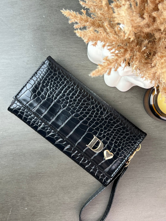 CARTERA MUÑEQUERA NEGRO ALIGATOR