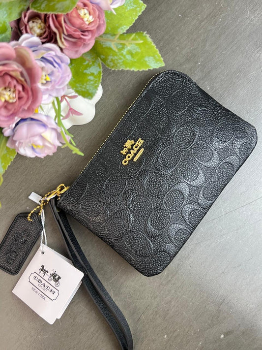 MUÑEQUERA COACH NEGRO GRABADO