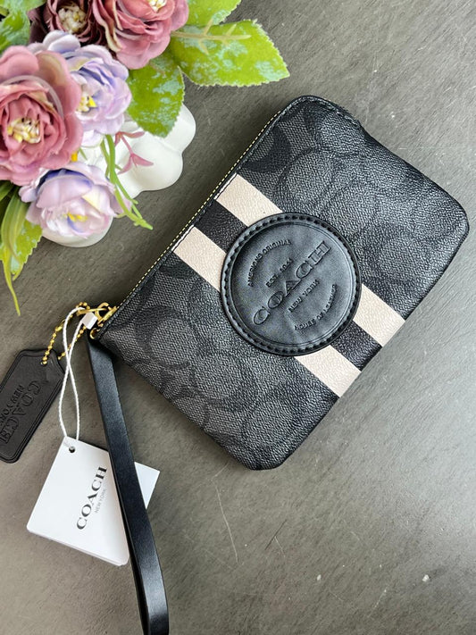 MUÑEQUERA COACH NEGRO FRANJAS BLANCO