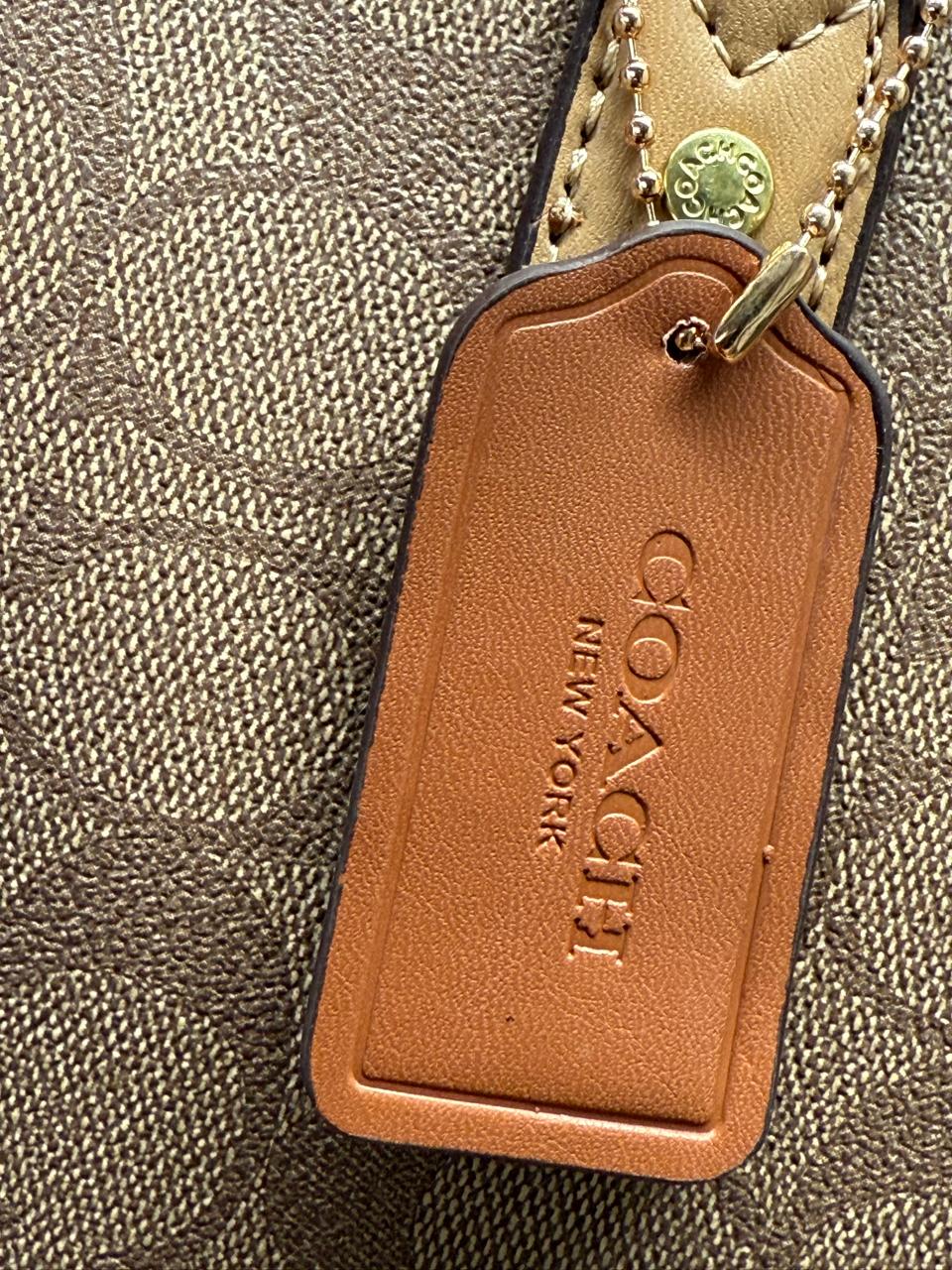 BOLSO COACH CON COSMETIQUERA NEGRO LISO
