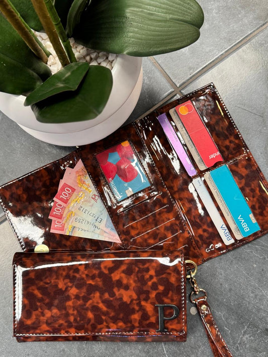 CARTERA MUÑEQUERA CAREY CHAROL