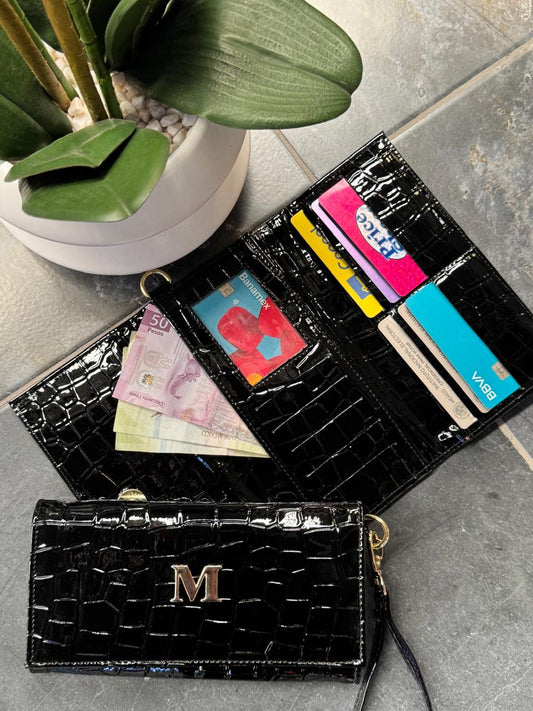 CARTERA MUÑEQUERA NEGRO DRILO CHAROL