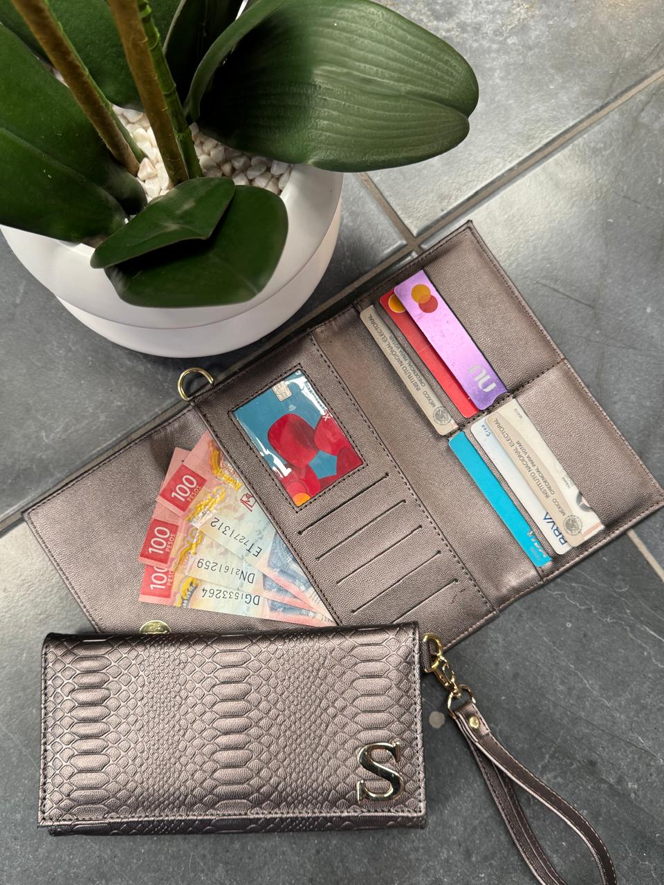 CARTERA MUÑEQUERA VIBORA METAL ACERO