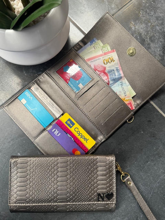 CARTERA MUÑEQUERA VIBORA INOX