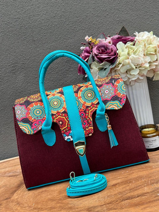 BOLSO MALETIN YUTE VINO/ESMERALDA TAPA FLORES