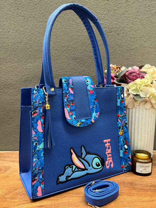 BOLSA BROCHE PERSONAJE STITCH ACOSTADO AZUL