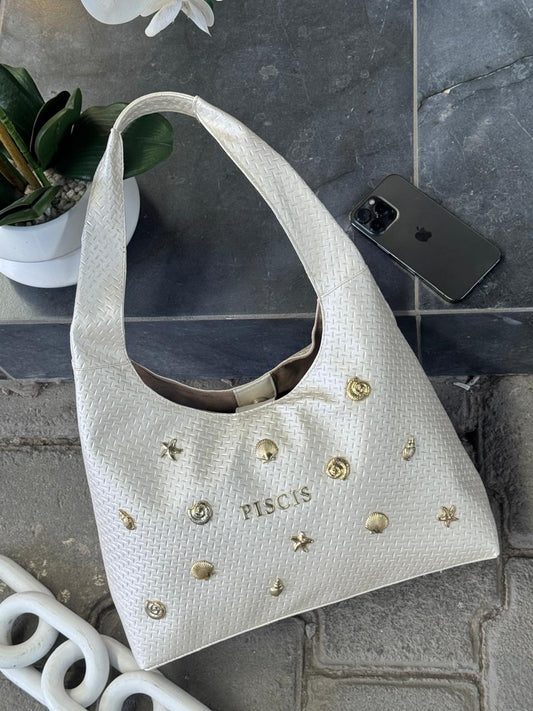 BOLSO ARTEMISA COLOR PALOMITA METALICO