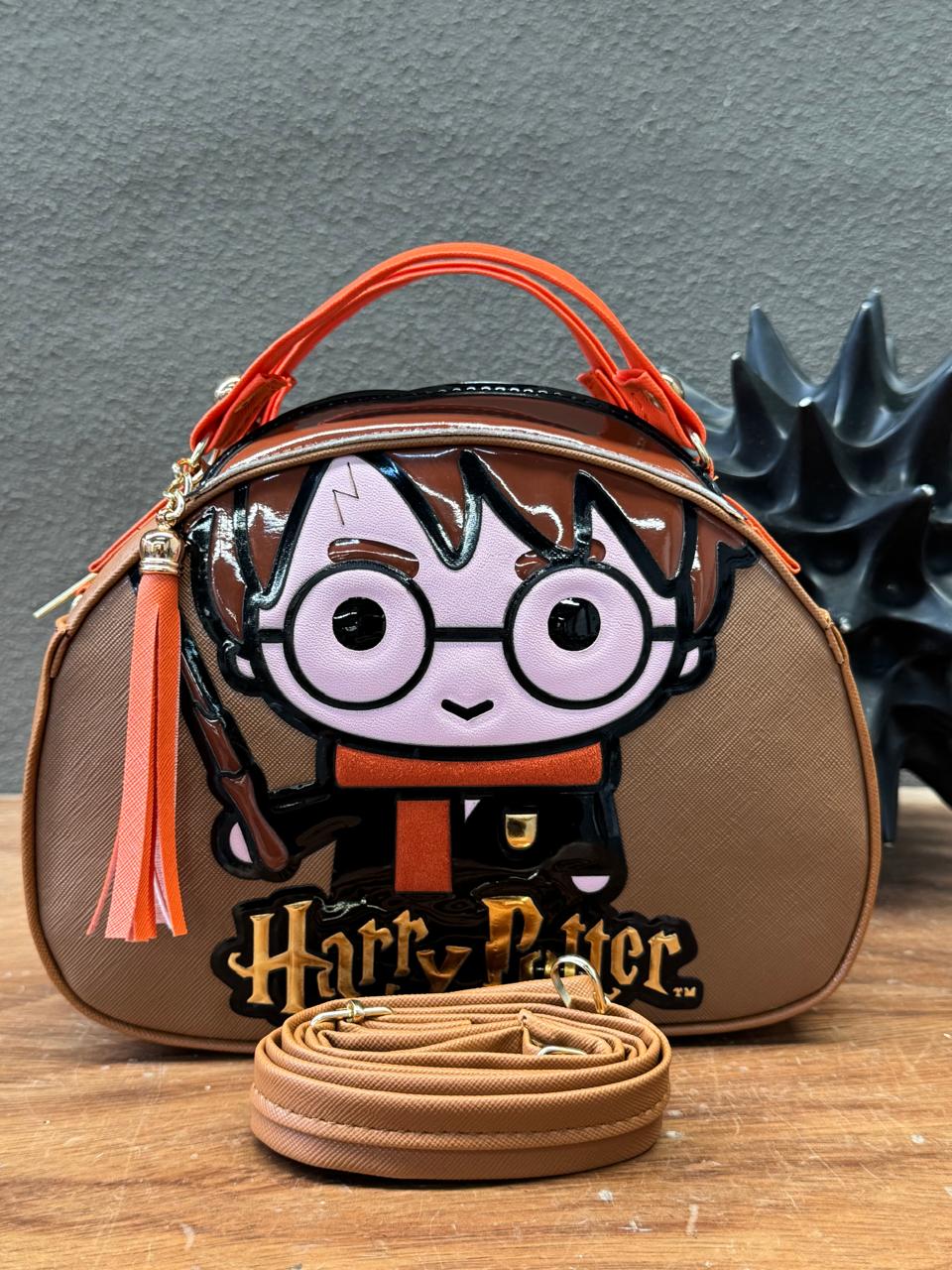 MALETITA PERSONAJE HARRY CAMEL/NARANJA