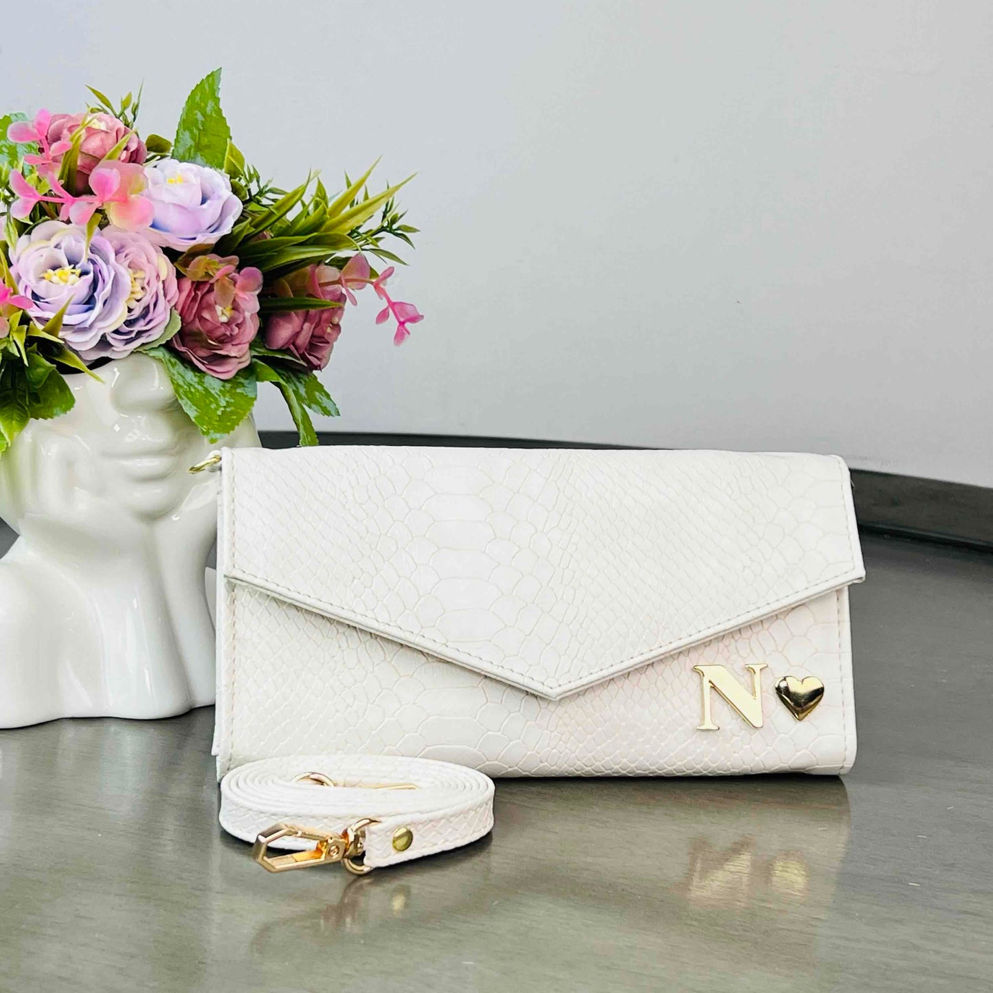 PORTACELULAR/CARTERA HUESO PITON
